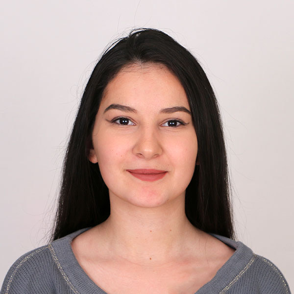 Studio portrait of Stanimira, accountant at Aidos, neutral background, professional headshot.