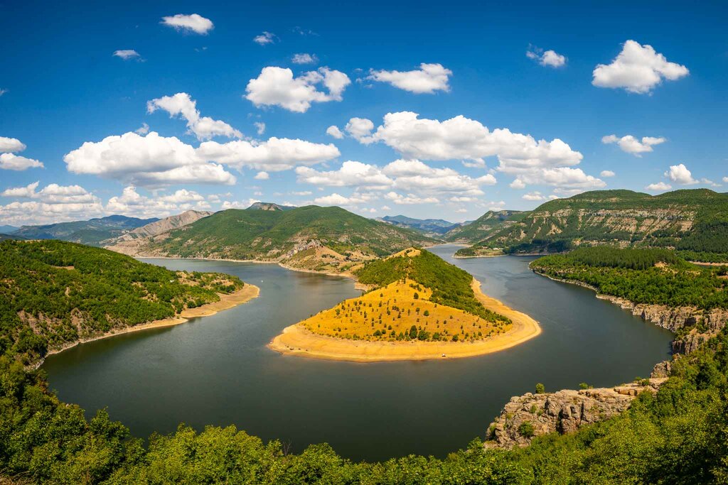 Arda River meanders in southern Bulgaria surrounded by mountains and forest